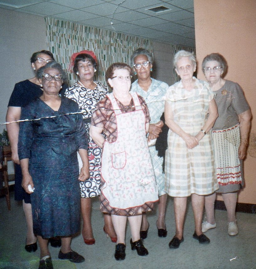 Grandma Edna Robinson, third from left, and her best buddies in the church and Evans Tower kitchens.
